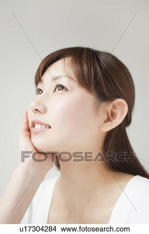 A young woman smiling View Large Photo Image Picture - A young woman smiling. Fotosearch