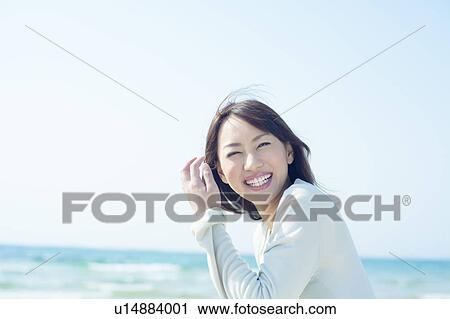 A young woman smiling View Large Photo Image Stock Image - A young woman smiling. Fotosearch