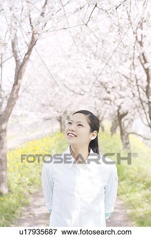 Stock Photo - A young woman smiling. Fotosearch