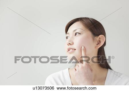 Stock Photograph - A young woman smiling. Fotosearch
