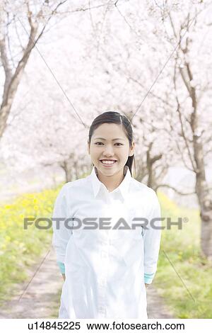A young woman smiling View Large Photo Image Stock Photography - A young woman smiling. Fotosearch