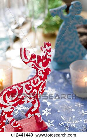 Angel and reindeer figurine View Large Photo Image Stock Photo - Angel and reindeer figurine. Fotosearch