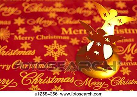 Stock Photograph - Angel candle holder. Fotosearch
