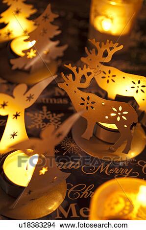 Picture - Angel, Christmas tree and reindeer candle holders. Fotosearch