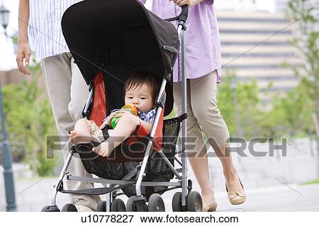 Stock Photo - Baby Boy in Buggy. Fotosearch