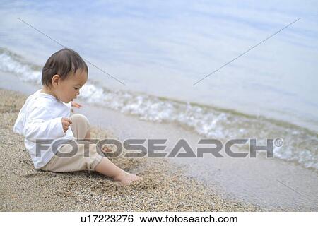 Baby girl sitting by lake View Large Photo Image Stock Photograph - Baby girl sitting by lake. Fotosearch