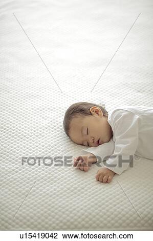 Stock Image - Baby girl sleeping. Fotosearch