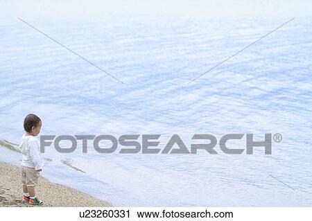 Baby girl standing by lake View Large Photo Image Stock Image - Baby girl standing by lake. Fotosearch