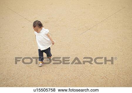 Baby girl walking View Large Photo Image Stock Photo - Baby girl walking. Fotosearch