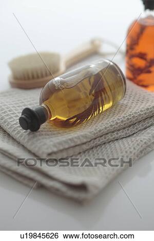Stock Photograph - Bath Oil on Towel. Fotosearch