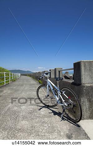 Stock Image - Bicycle Under Blue Sky. Fotosearch