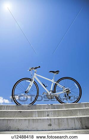 Stock Photo - Bicycle Under Blue Sky. Fotosearch