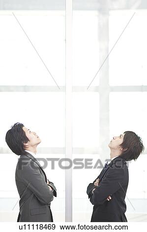 Stock Photo - Business people looking up. Fotosearch