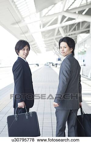 Stock Photo - Business people smiling. Fotosearch