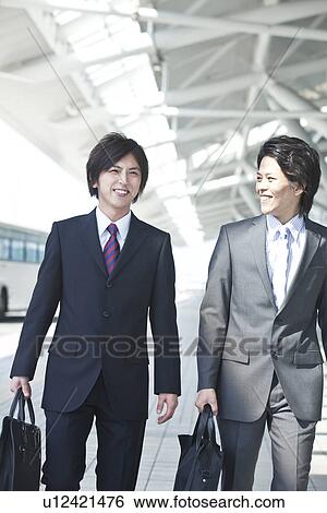 Stock Photograph - Business people walking. Fotosearch
