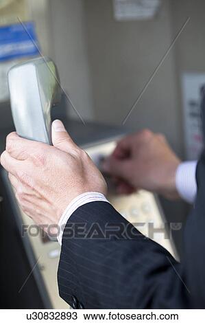Businessman Using Pay Phone View Large Photo Image Stock Image - Businessman Using Pay Phone. Fotosearch