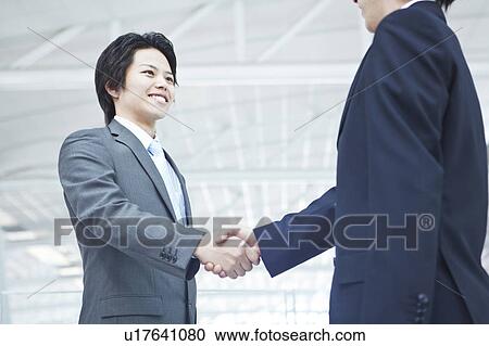 Businessmen shaking hands View Large Photo Image Stock Image - Businessmen shaking hands. Fotosearch