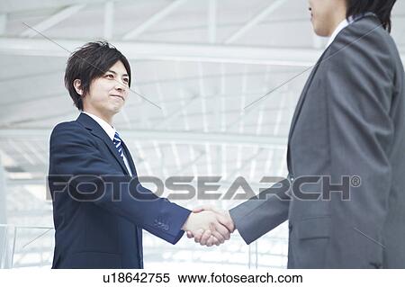 Businessmen shaking hands View Large Photo Image Stock Photography - Businessmen shaking hands. Fotosearch