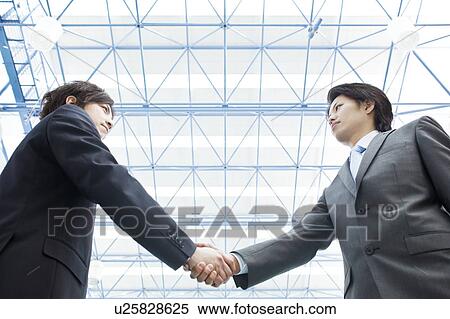 Businessmen shaking hands View Large Photo Image Stock Photography - Businessmen shaking hands. Fotosearch