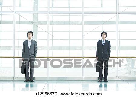 Stock Image - Businessmen standing. Fotosearch