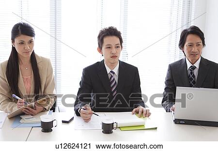 Businesspeople having a meeting View Large Photo Image Stock Image - Businesspeople having a meeting. Fotosearch
