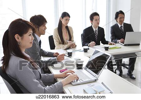 Businesspeople having a meeting View Large Photo Image Stock Image - Businesspeople having a meeting. Fotosearch
