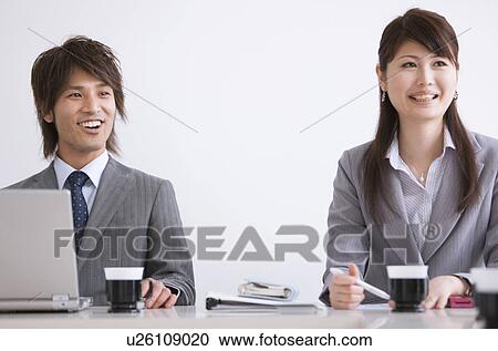 Businesspeople having a meeting View Large Photo Image Stock Image - Businesspeople having a meeting. Fotosearch