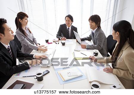 Businesspeople having a meeting View Large Photo Image Stock Photo - Businesspeople having a meeting. Fotosearch