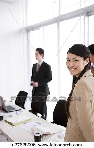 Businesspeople having a meeting View Large Photo Image Stock Photograph - Businesspeople having a meeting. Fotosearch