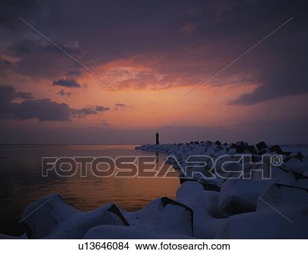 Cape and Lighthouse at Winter Dawn View Large Photo Image Picture - Cape and Lighthouse at Winter Dawn. Fotosearch
