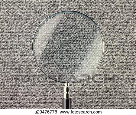 Stock Photo - Carpet Seen Through Magnifying Glass. Fotosearch