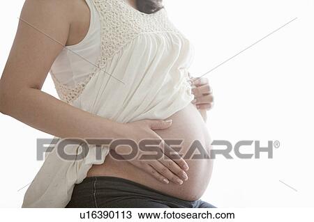 Stock Image - Close Up of Pregnant Woman. Fotosearch