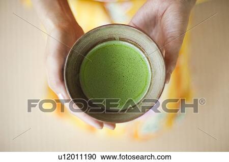 Close Up of Woman Holding Cup of Powdered Tea View Large Photo Image Stock Image - Close Up of Woman Holding Cup of Powdered Tea. Fotosearch