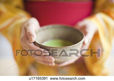 Close Up of Woman Holding Cup of Powdered Tea View Large Photo Image Stock Image - Close Up of Woman Holding Cup of Powdered Tea. Fotosearch