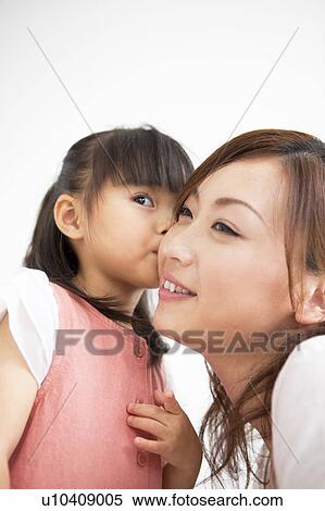 Daughter kissing mother View Large Photo Image Stock Photography - Daughter kissing mother. Fotosearch