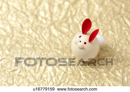 Decorative Rabbit on Golden Background View Large Photo Image Stock Photo - Decorative Rabbit on Golden Background. Fotosearch