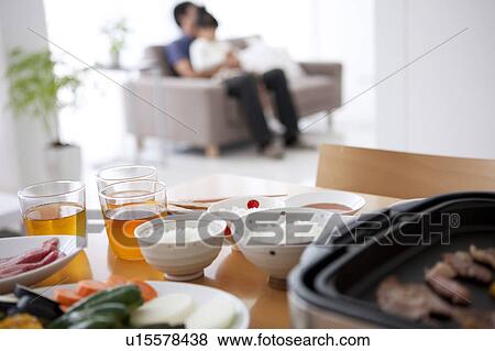 Dinner on Table, Father and Child in Background View Large Photo Image Stock Photo - Dinner on Table, Father and Child in Background. Fotosearch