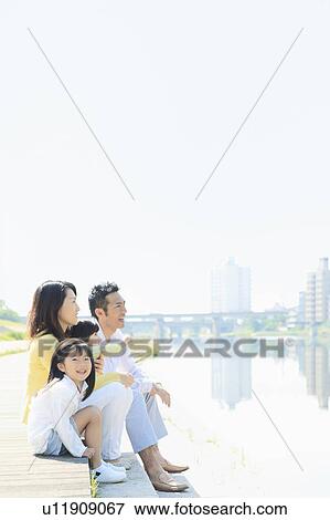 Family of Four at Waterfront View Large Photo Image Stock Photo - Family of Four at Waterfront. Fotosearch