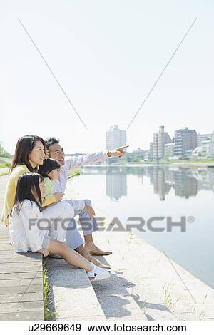 Stock Photo - Family of Four at Waterfront. Fotosearch