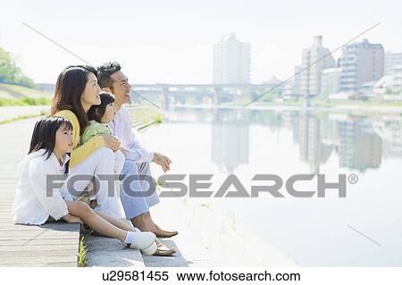 Stock Photography - Family of Four at Waterfront. Fotosearch