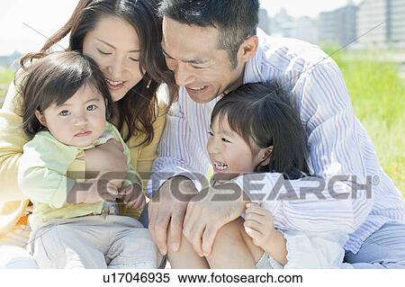 Family of Four Embracing Each Other View Large Photo Image Stock Photography - Family of Four Embracing Each Other. Fotosearch
