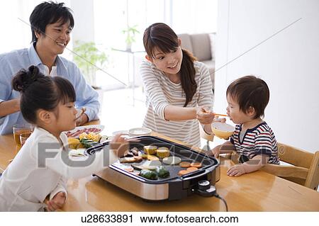 Family of Four Having Dinner View Large Photo Image Stock Image - Family of Four Having Dinner. Fotosearch