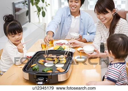 Family of Four Having Dinner View Large Photo Image Stock Photo - Family of Four Having Dinner. Fotosearch