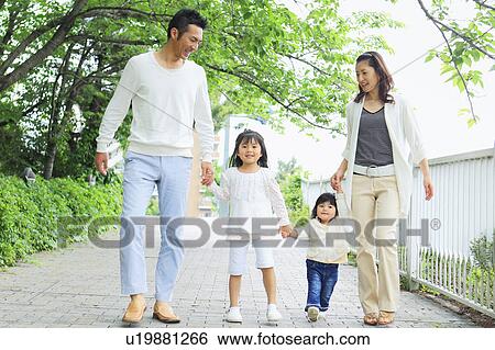 Family of Four Holding Hands and Walking in Park View Large Photo Image Stock Photograph - Family of Four Holding Hands and Walking in Park. Fotosearch
