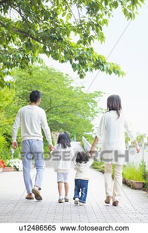 Family of Four Holding Hands and Walking in Park View Large Photo Image Stock Photography - Family of Four Holding Hands and Walking in Park. Fotosearch
