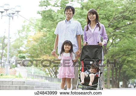 Stock Photo - Family of Four in Park. Fotosearch