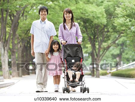 Family of Four Walking in Park View Large Photo Image Stock Image - Family of Four Walking in Park. Fotosearch