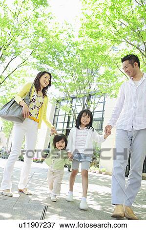 Family of Four Walking in Park View Large Photo Image Stock Photo - Family of Four Walking in Park. Fotosearch