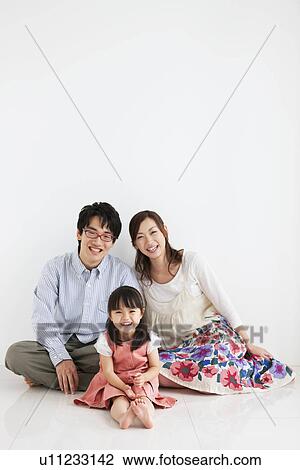 Family sitting and smiling View Large Photo Image Stock Image - Family sitting and smiling. Fotosearch