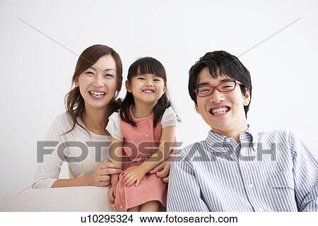 Family sitting on sofa View Large Photo Image Picture - Family sitting on sofa . Fotosearch